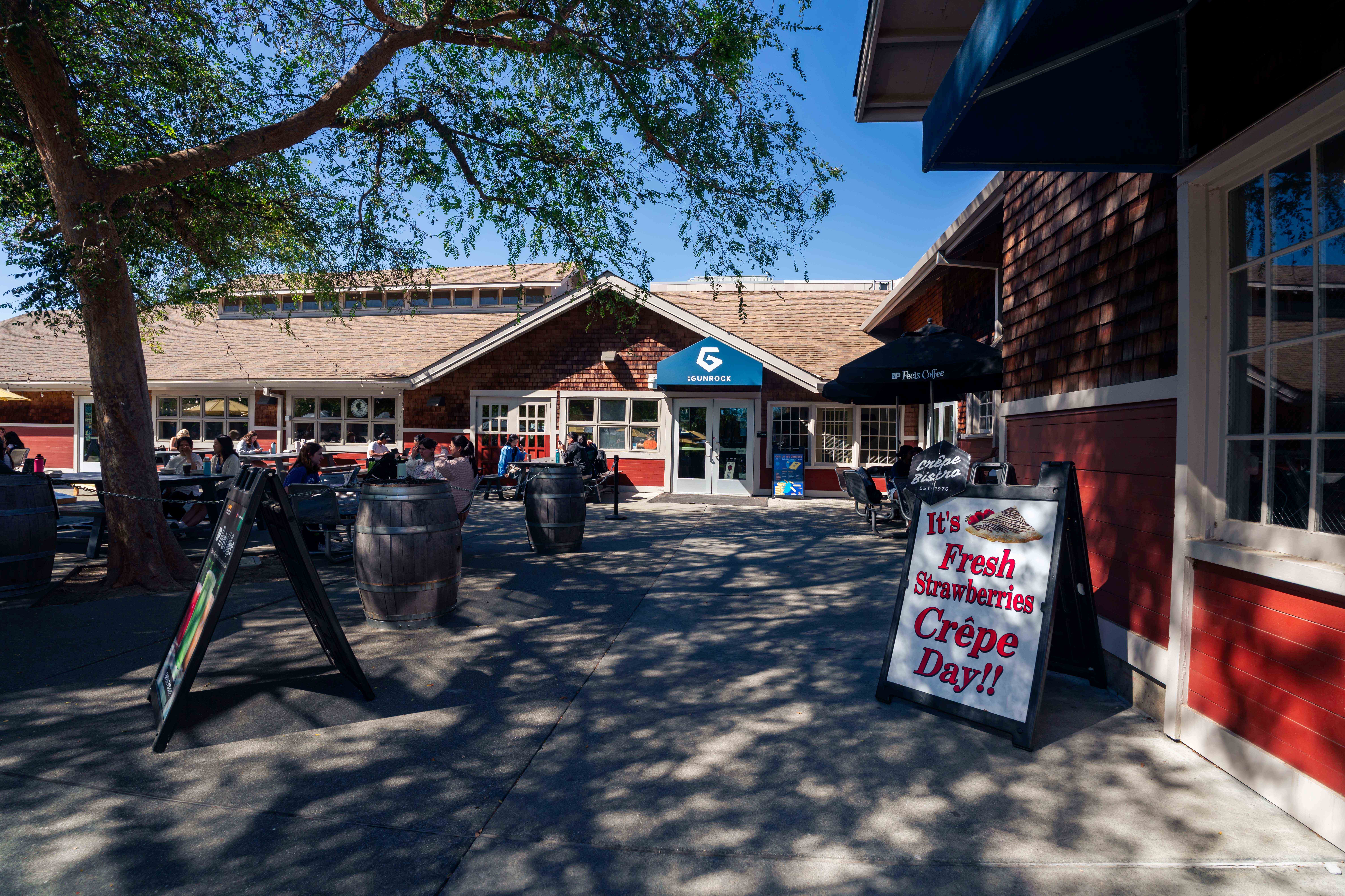 The silo at UC Davis with a sign out front that says it's fresh strawberries crepe day
