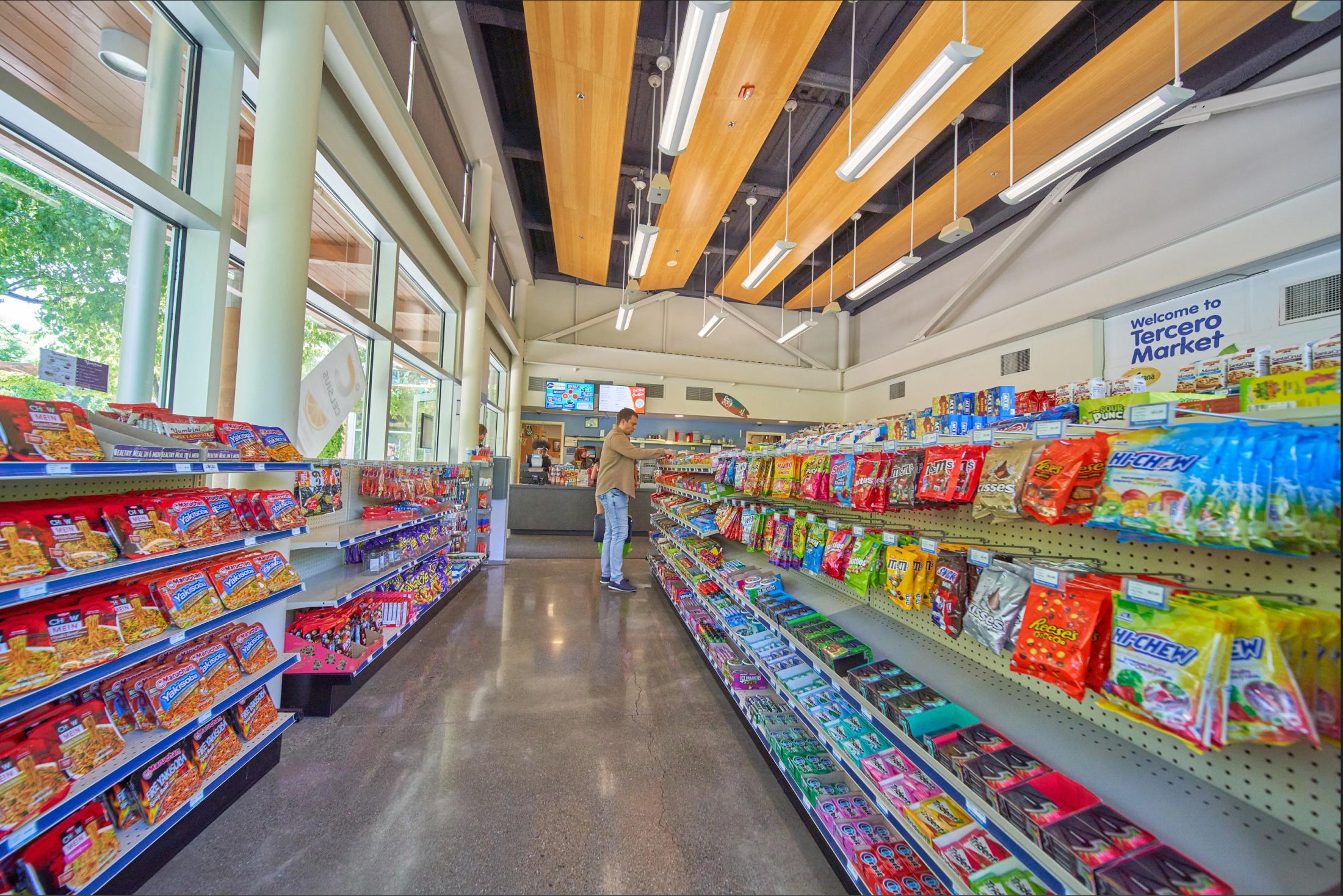 Customer peruses candy selection in Tercero Residential Market