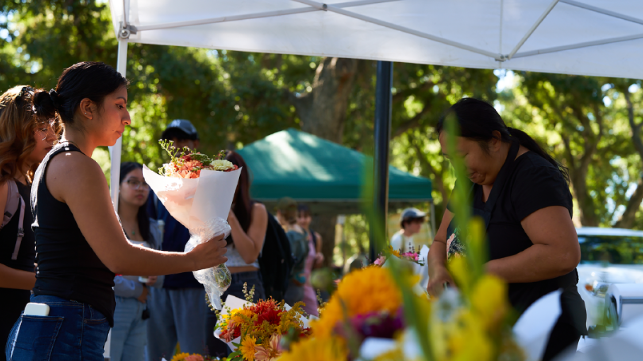A woman buying flowers