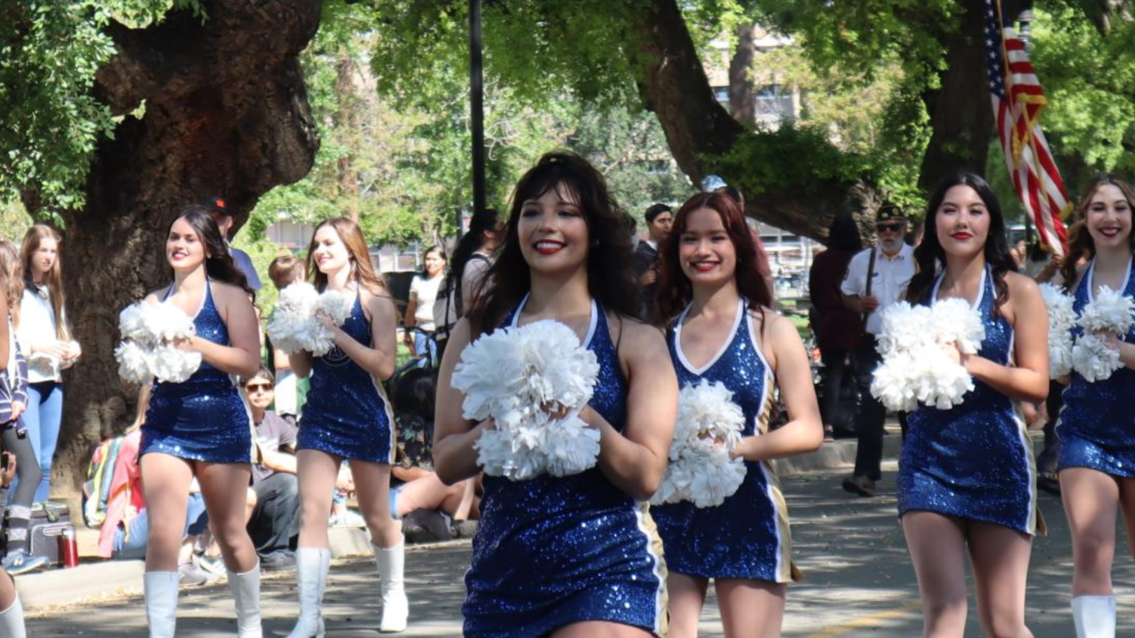 UC Davis Dance Team members march in uniform during Picnic Day Parade
