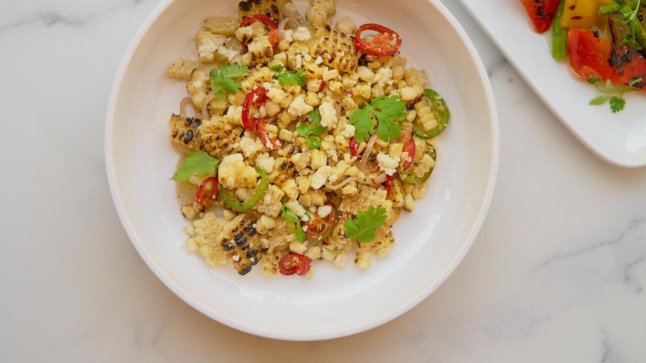 Bowl of mixed corn with peppers and herbs