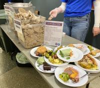 Display table with food waste collected from previous waste study
