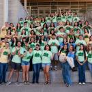 First Year Experience Staff stands in the Teaching & Learning Complex Stairway. 